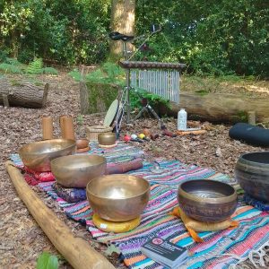 out door sound bath set up showing singing bowls